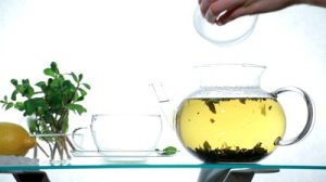 stock-footage-herbal-tea-in-clear-glass-teapot